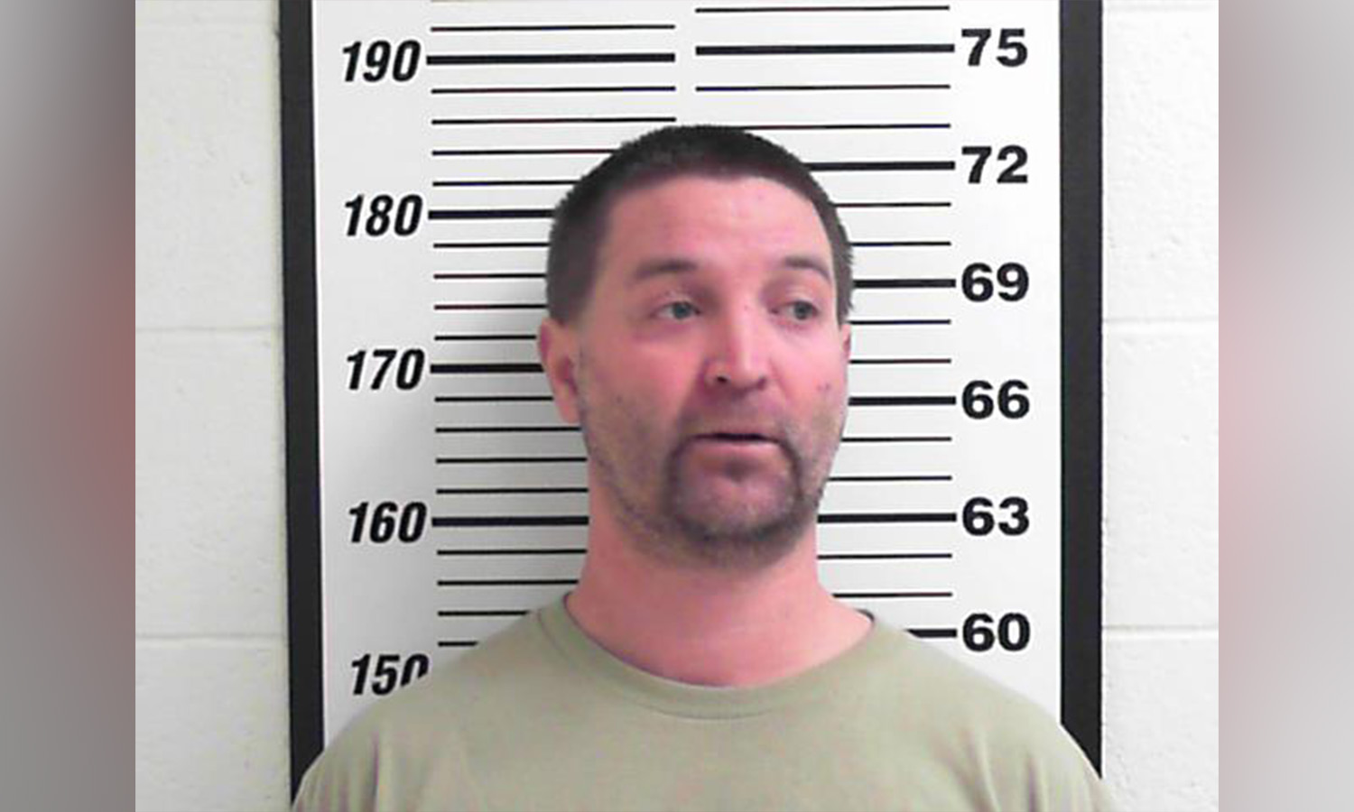 Police: Man choked son with football jersey to break up fight