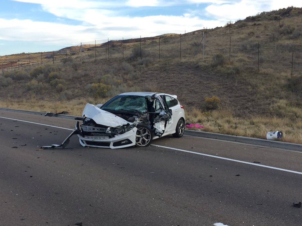 Man hospitalized after car collides with cement truck