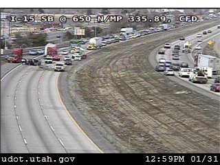 Crash flips car over barrier on I-15 in Clearfield