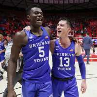 No. 18 BYU outlasts rival Utah 75-64 to stay undefeated on the season