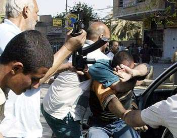 Iraqis Turn Vigilante to Stop Looting