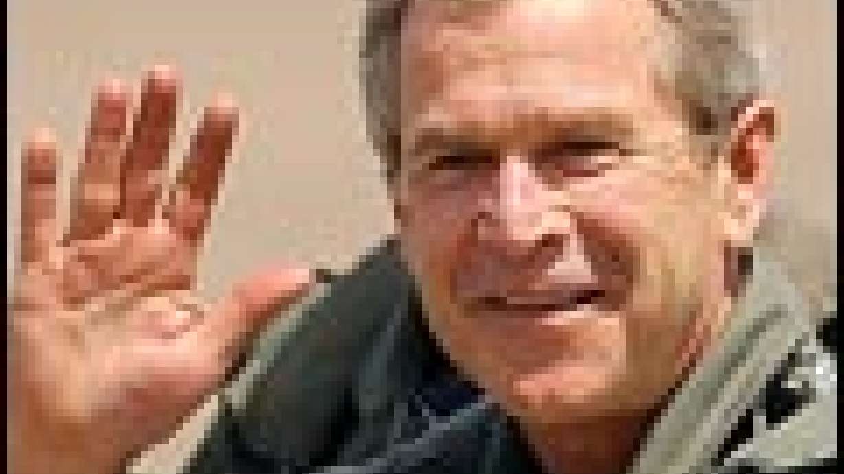 Bush Visits Returning Troops, Defense Contractor