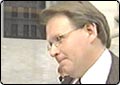 Finance Chief Back on Stand for Bribery Trial