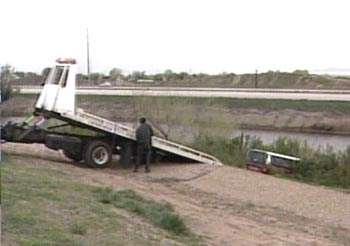Truck Drives off I-15, Lands in Pond