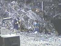 Attorney to Challenge Confession; Search Continues