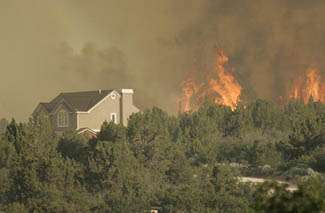 Firefighters Hold Back Flames Near New Harmony