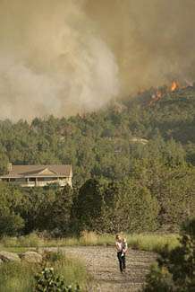 Firefighters Hold Back Flames Near New Harmony