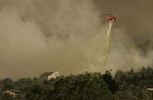 Firefighters Hold Back Flames Near New Harmony