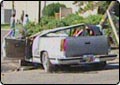 Truck Rolls After Hitting Telephone Pole