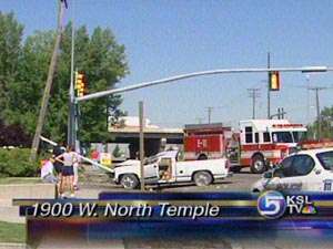 Truck Rolls After Hitting Telephone Pole