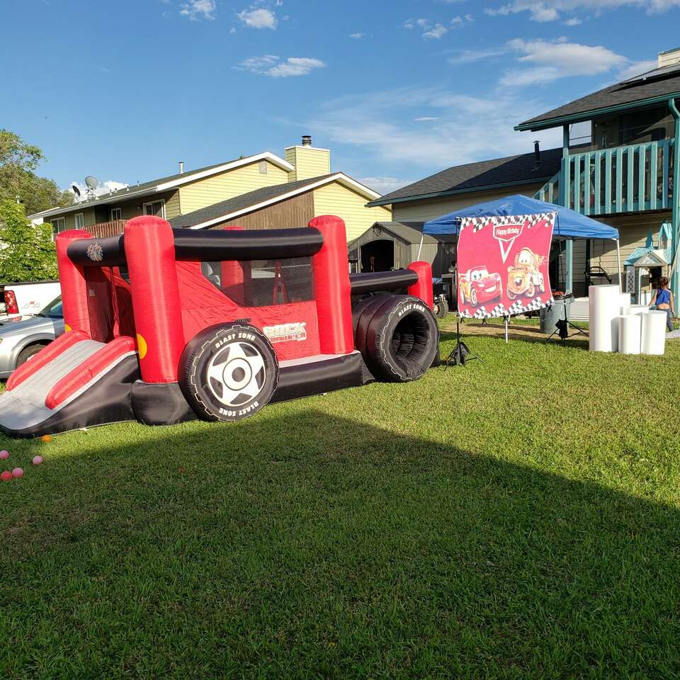 Off road truck bounce house with ball pit for rent