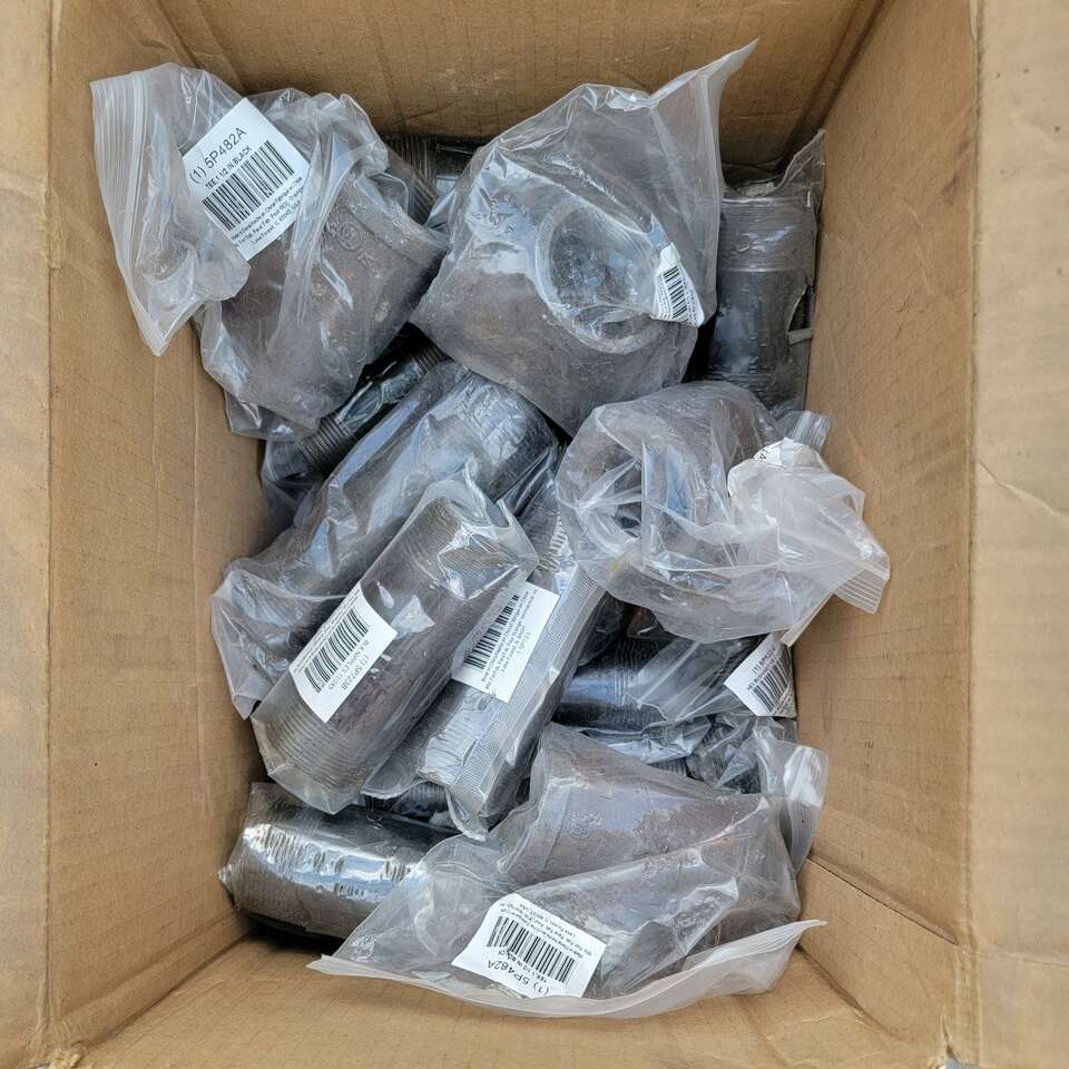 Box of 1 1/2" pipe fittings