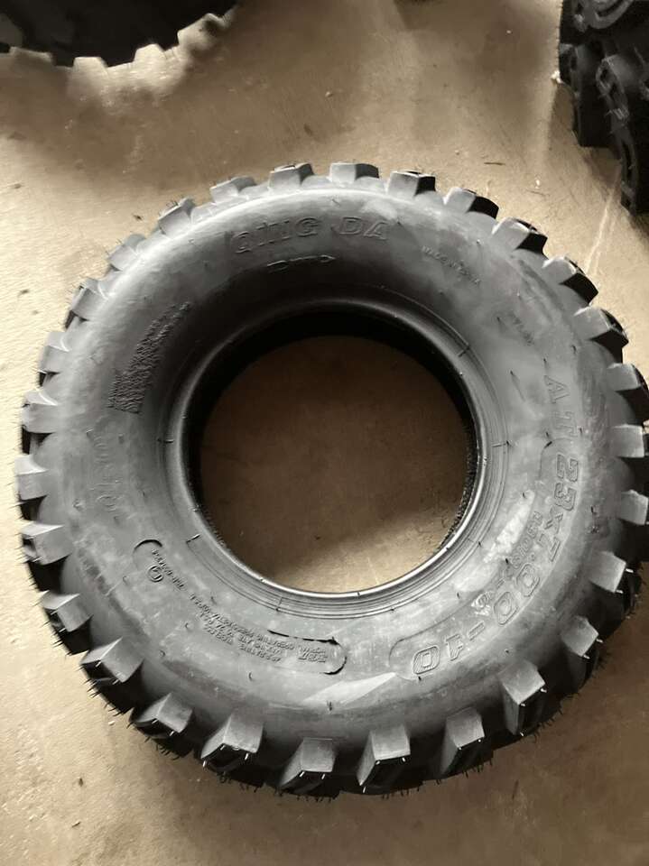 Two QingDa AT 23x7.00-10