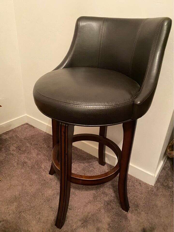 Estate Sale - Dark brown cherry wood swivel stool. Very large comfortable seat