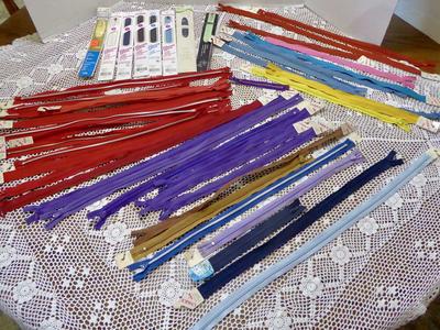 Assorted Lot Of ( 44 ) New Zippers- In Several Colors And Sizes- With A Metal Or Polyester Zipper