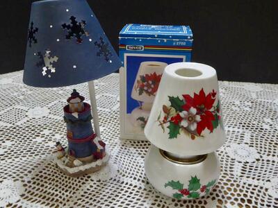 Two Separate Christmas Votive Candle Holders- One Light House With A Snowman And One White With Red Flowers With A Box