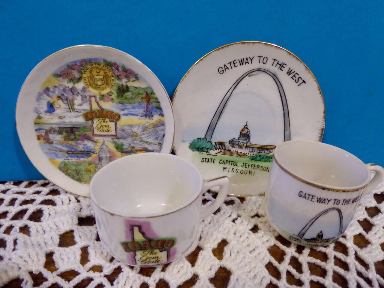 Set Of 2 Collectible Mini Porcelain Tea Cup With Saucer / Plate From Jefferson City Missouri And The Gem State Idaho