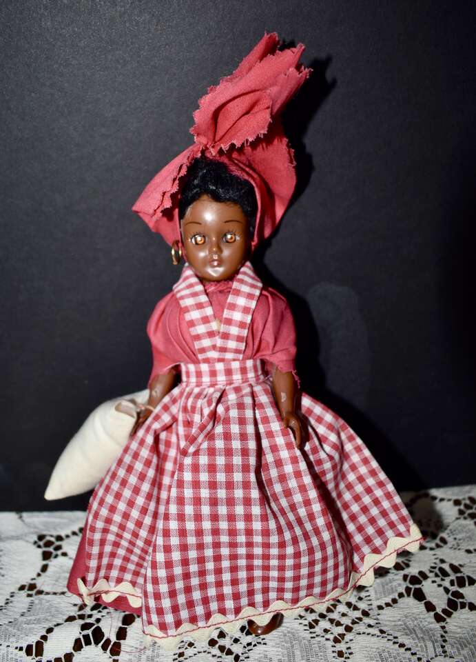 Vintage 8 Inch Celluloid Doll Wearing A Red/ White Checkered Apron/ Dress With Working Eyes