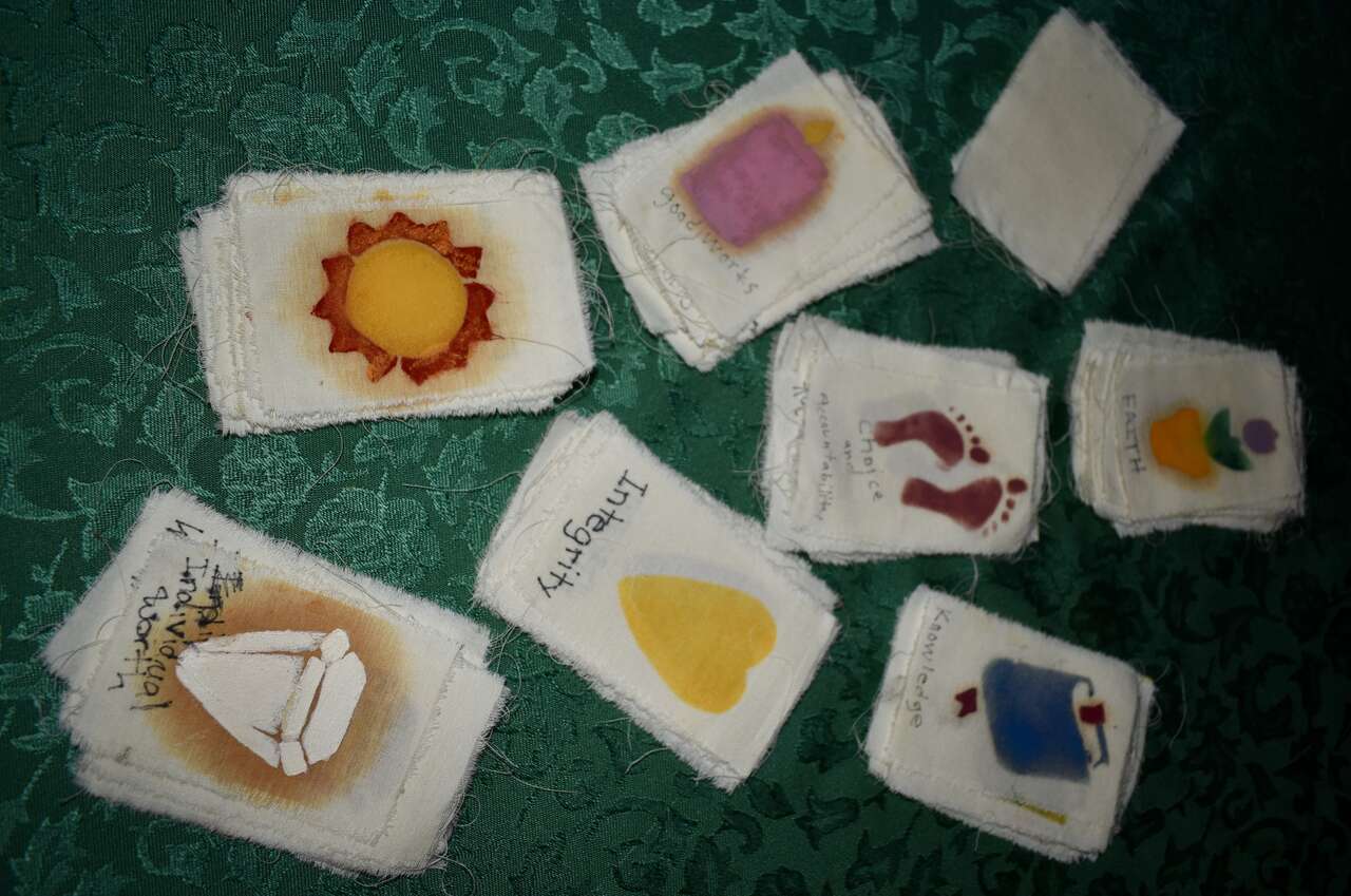 A Set Of 78 Hand Painted Pieces Of Fabric With The Young Women Theme And Values On Each