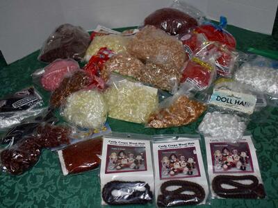 Several Assorted Bags Of Fun Wavy And Curly Doll Hair In Different Sizes, Colors, And Kinds