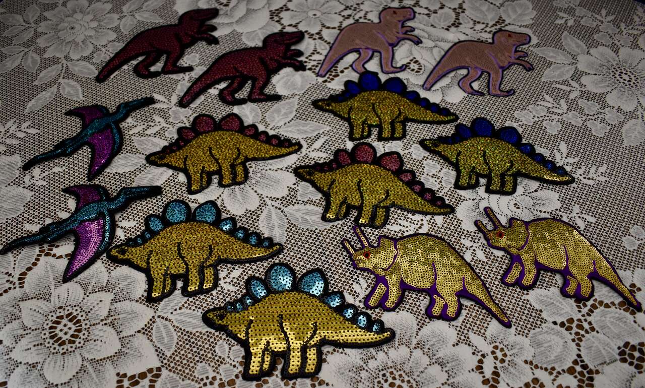 Several Really Fun Assorted Dinosaur Appliques Figures Made With A Shiny Sequin Type Fabric / Material