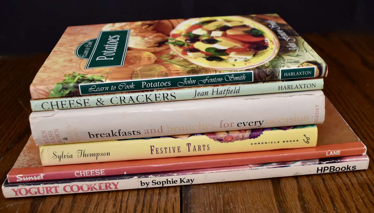 A LOT OF 6 ASSORTED COOKBOOKS WITH RECIPES FOR CHEESE, YOGURT, TARTS, POTATOES, CRACKERS AND MORE…