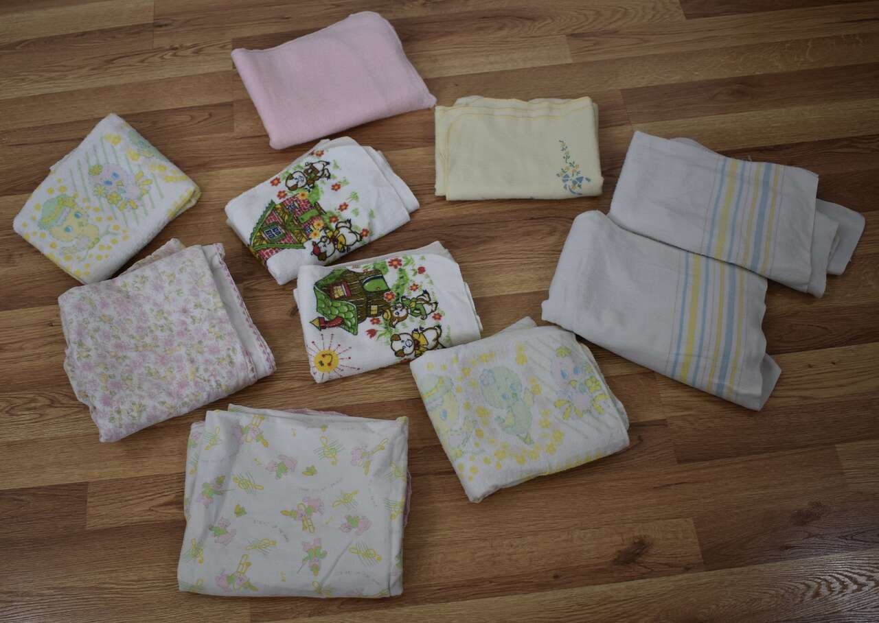 Several Assorted Vintage Flannel Baby Receiving Blankets in Different Sizes And Colors
