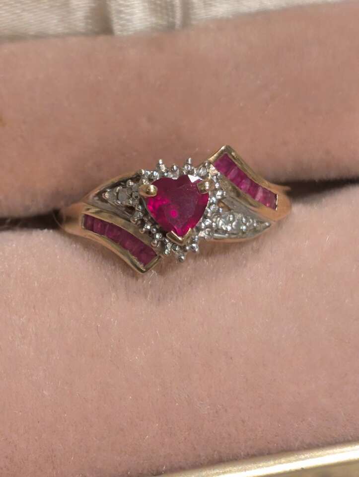 Heart shaped center stone ruby and diamond ring