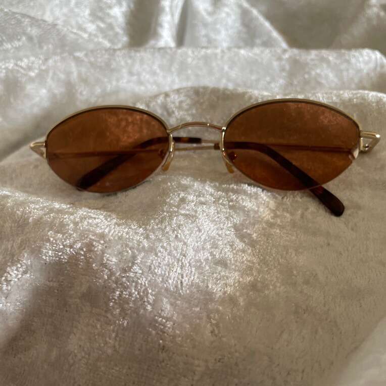 Sunglasses With Spring Loaded Frame