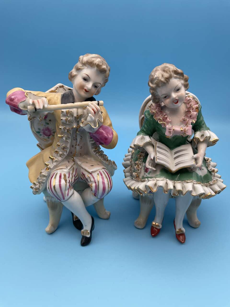 Well Dressed Couple - Man Playing His Flute While Woman Is Singing