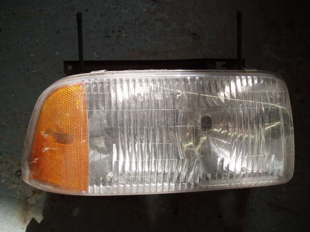 Right OEM headlight from 97 GMC Jimmy