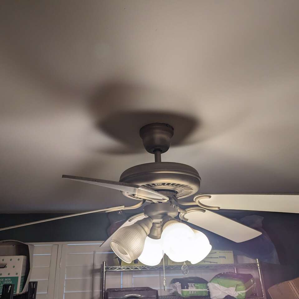 Silver fan with reversible blades and lights