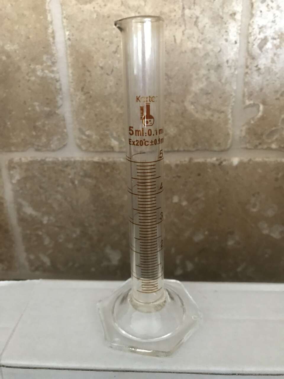 Small glass measuring cylinder