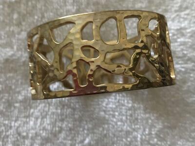 Bracelet - Gold in color - one inch in width