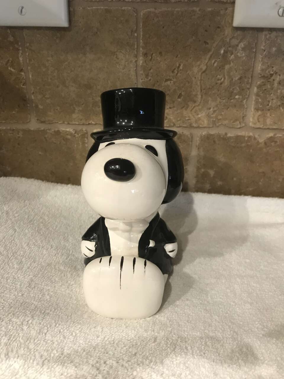 Snoopy dressed in a Tuxedo and it's a Bank