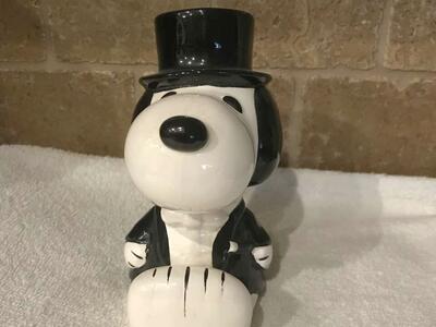 Snoopy dressed in a Tuxedo and it's a Bank