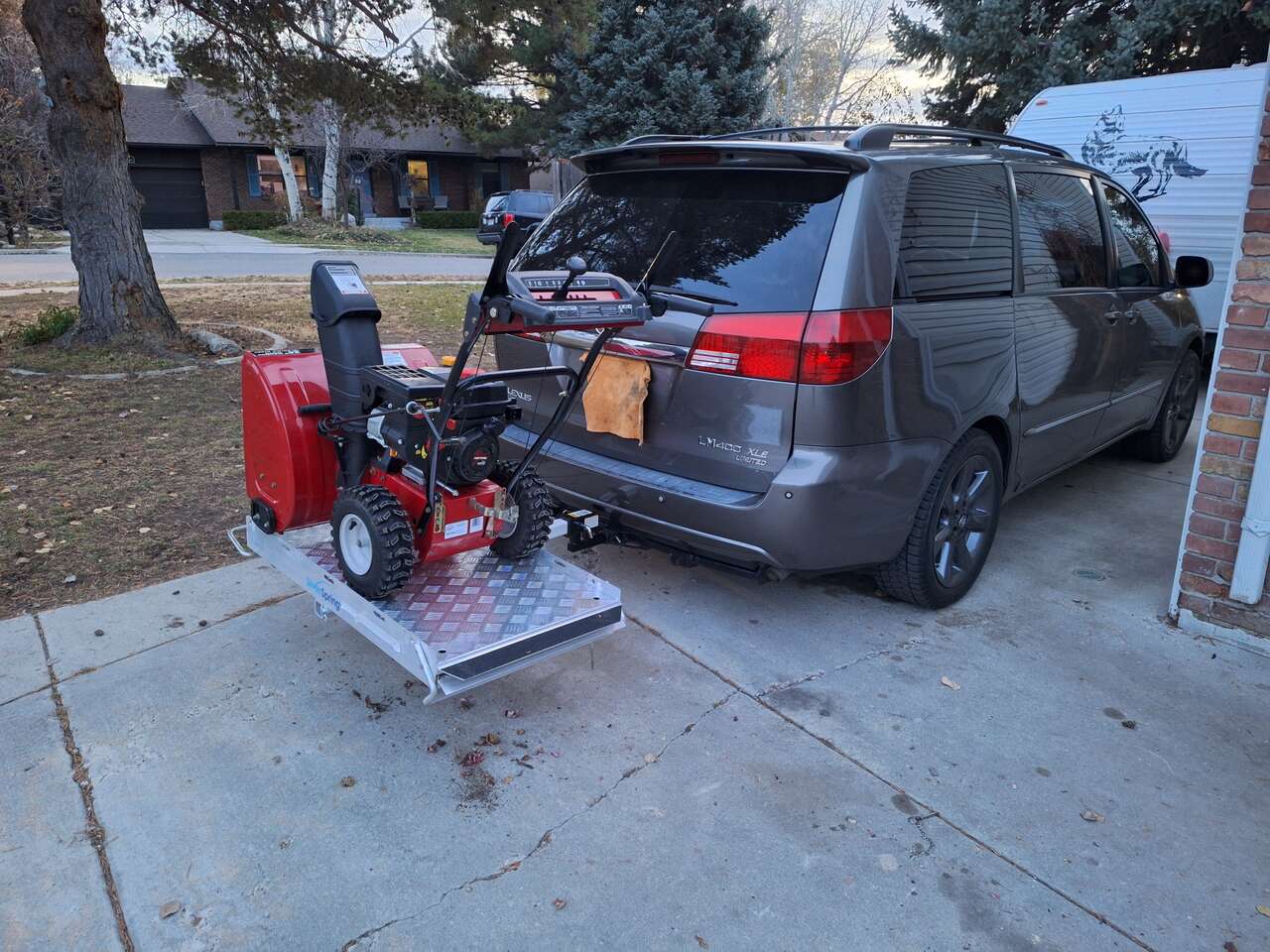 All aluminum folding carrier with slide out ramp