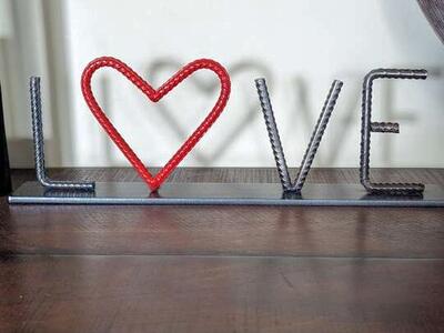 Metal rebar love valentine sign.