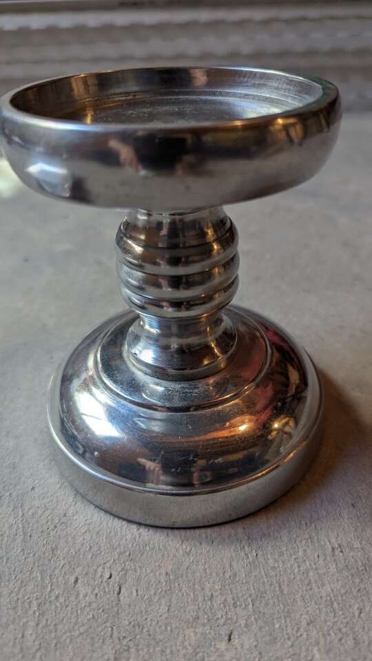 Polished pewter candle holders