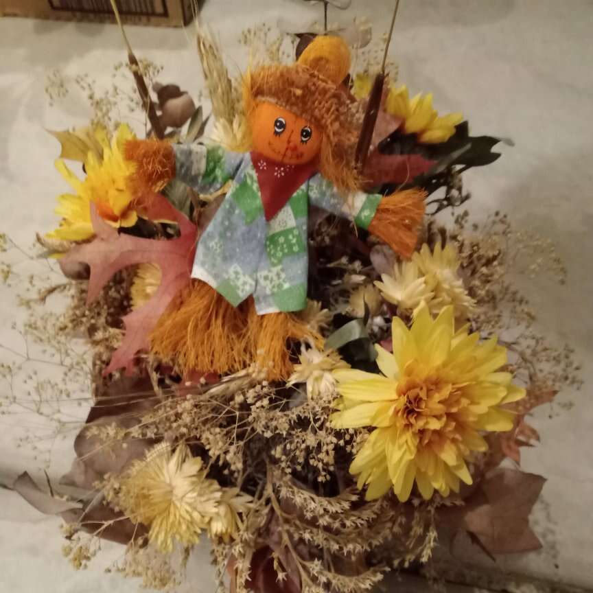 Floral Arrangement With Scarecrow $15