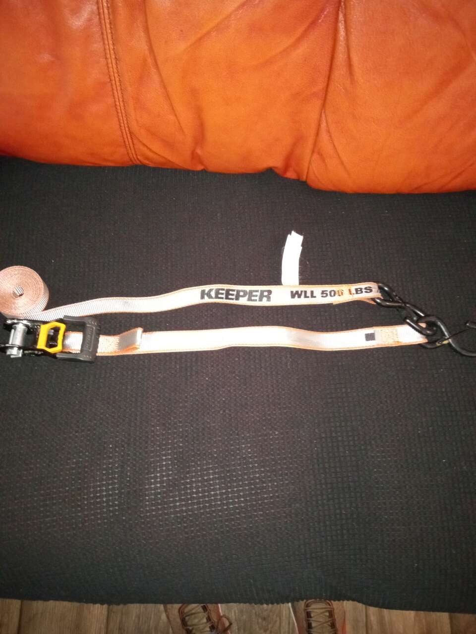 Ratchet keeper tie down webbing