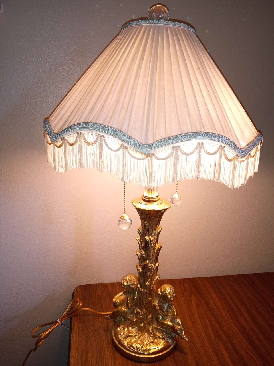 Gold plated brass lamp with heavy crystals and cherubs
