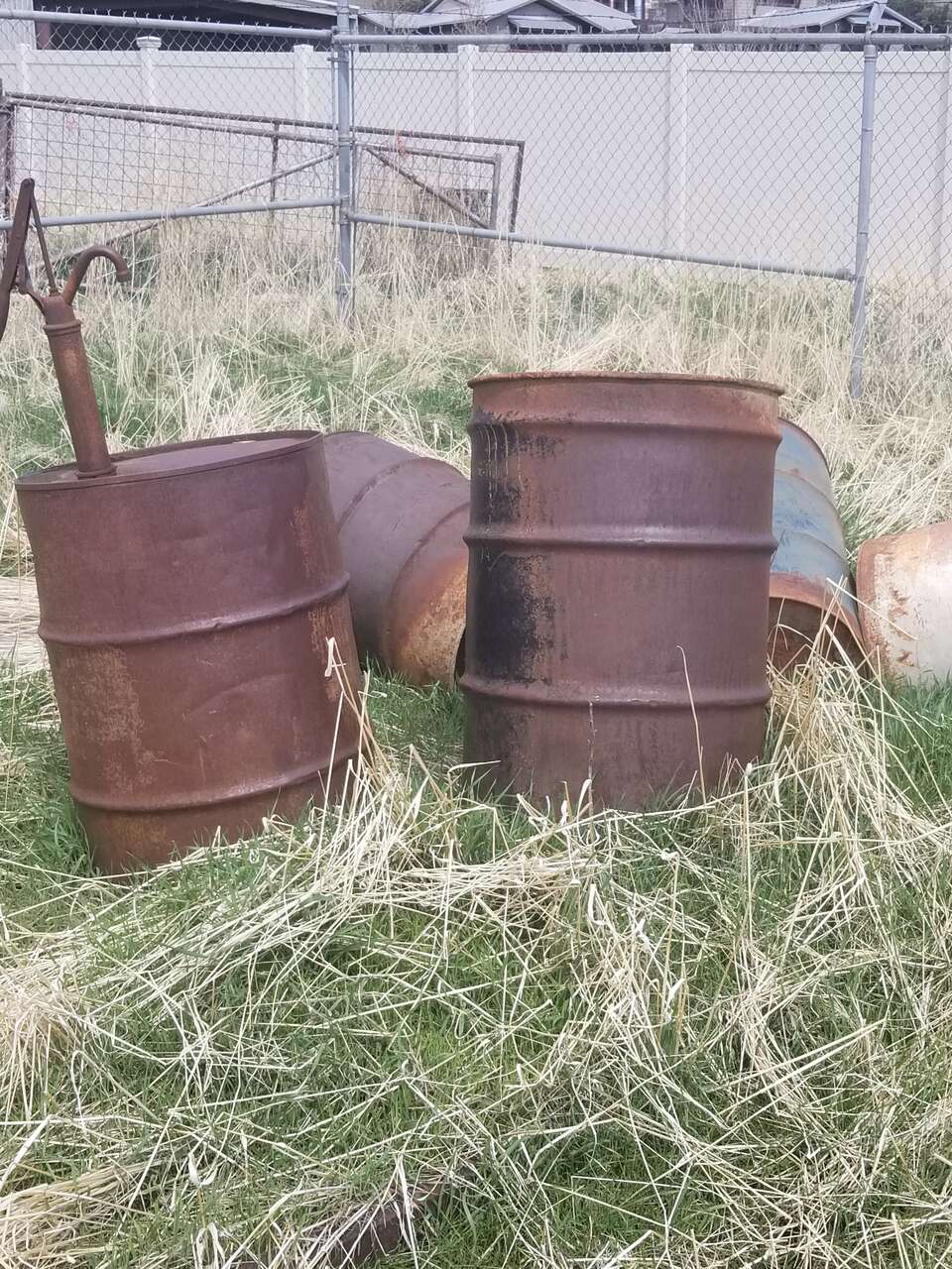 7 55 gallon storage drums
