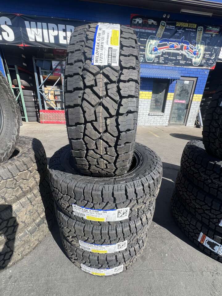 FULL SET OF LT275/65R18 FALKEN WILD PEAK A/T4 10PLY LOAD RANGE E WITH 55K MILES WARRANTY. AWESOME DEAL