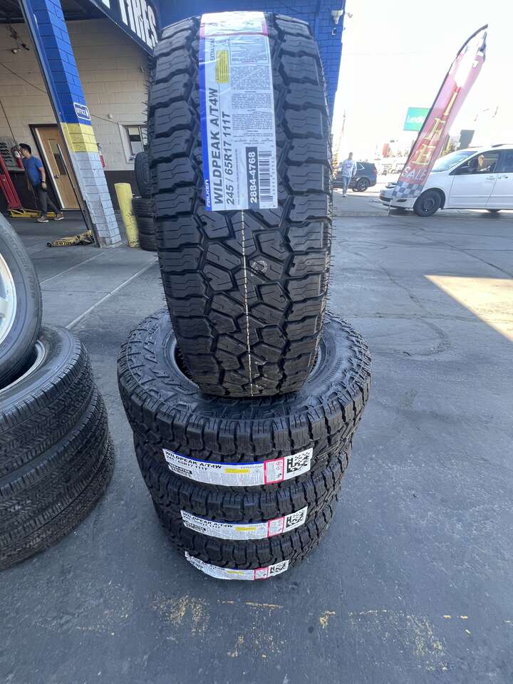 FULL SET OF P245/65R17 FALKEN WILD PEAK A/T4 WITH 55K MILES WARRANTY. AWESOME DEAL.