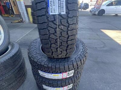 FULL SET OF P245/65R17 FALKEN WILD PEAK A/T4 WITH 55K MILES WARRANTY. AWESOME DEAL.