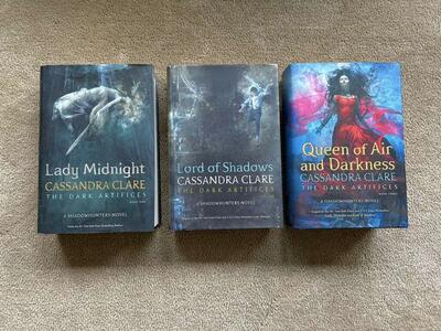 The Dark Artifices Trilogy, by Cassandra Clare (hardcovers)—ONE SIGNED