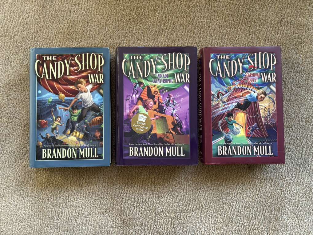The Candy Shop War Series, by Brandon Mull (hardcovers—one SIGNED)