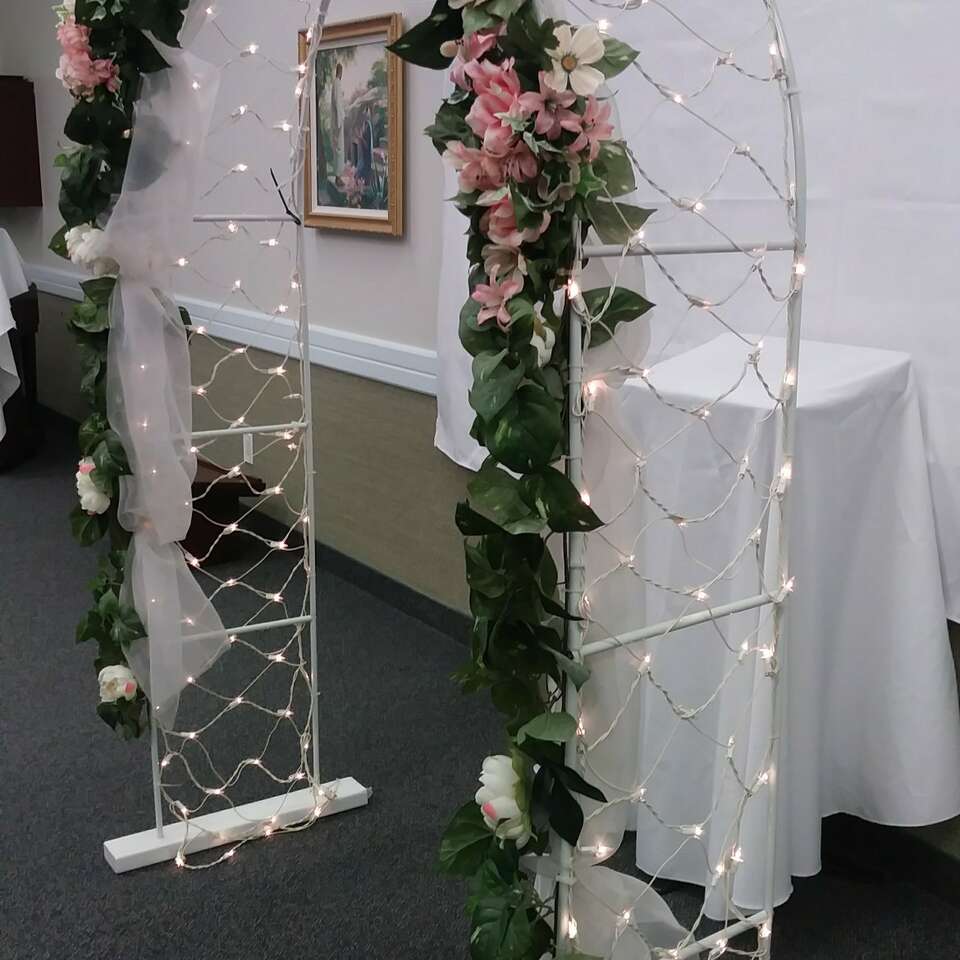 3 fully lit wedding arches with florals Weddings