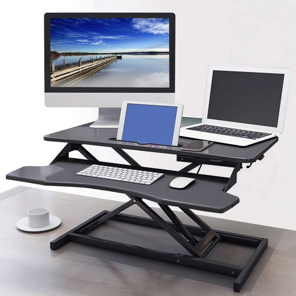 Adjustable raising computer desk